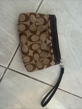 COACH Signature Monogram Wristlet in Brown and Tan